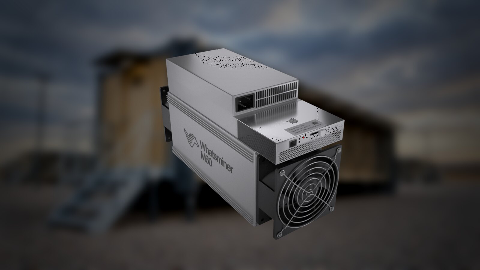 Un Whatsminer M60 fotografiado junto a un contenedor de minería
